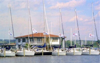 View of a marina with sailboats and boat house