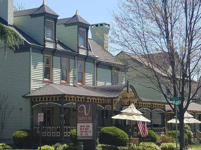 Green and yellow victorian style mansion