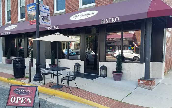 Bistro restaurant front with maroon awning
